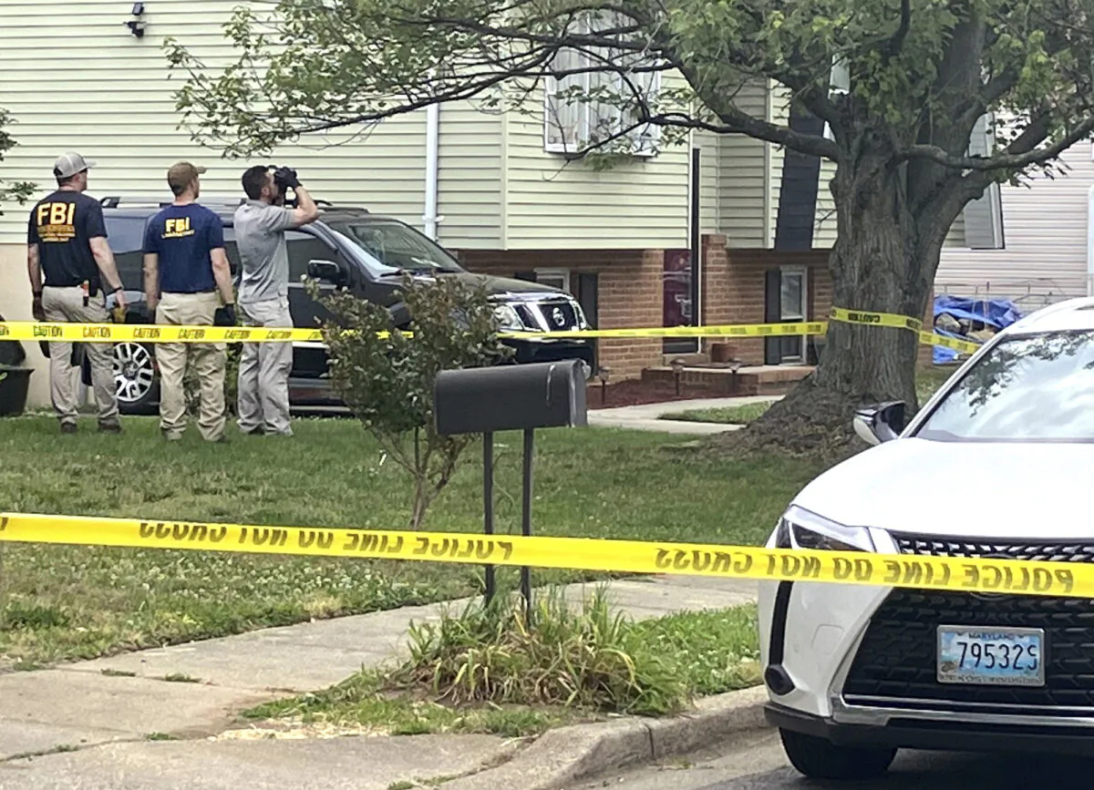 The FBI and other law enforcement agencies investigate the scene where six people were shot, three fatally in Annapolis, Md., on June 12, 2023. (Luke Parker/The Baltimore Sun via AP)