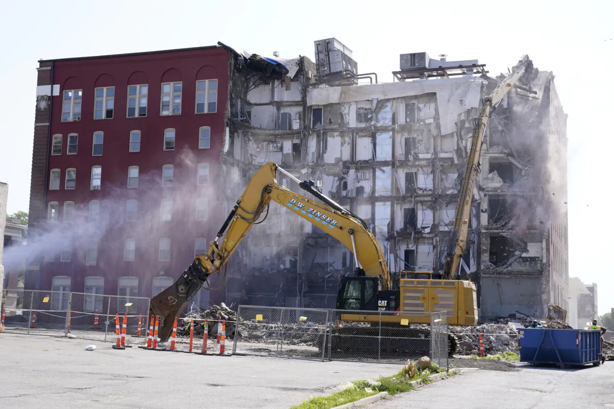 Workers begin demolition at the site of a building collapse in Davenport, Iowa on, June 12, 2023. (Charlie Neibergall/AP Photo)
