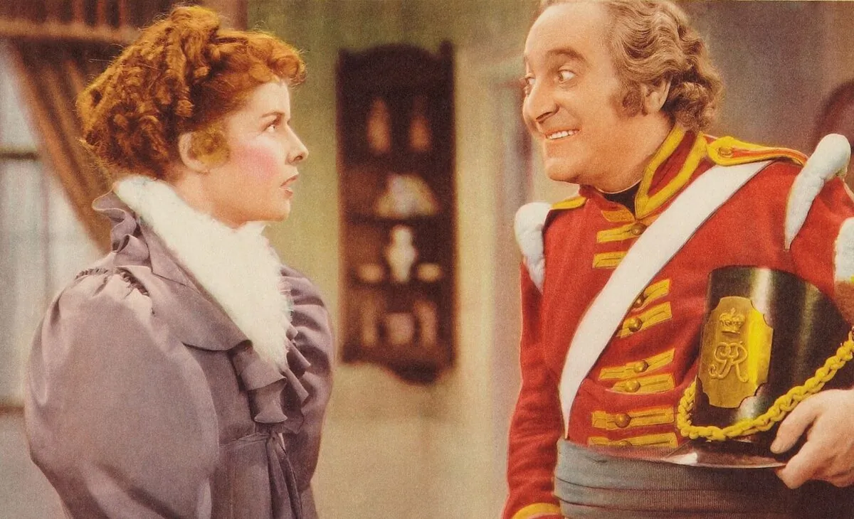 A cropped lobby card for the 1937 film "Quality Street" with Katharine Hepburn and Eric Blore. (MovieStillsDB)