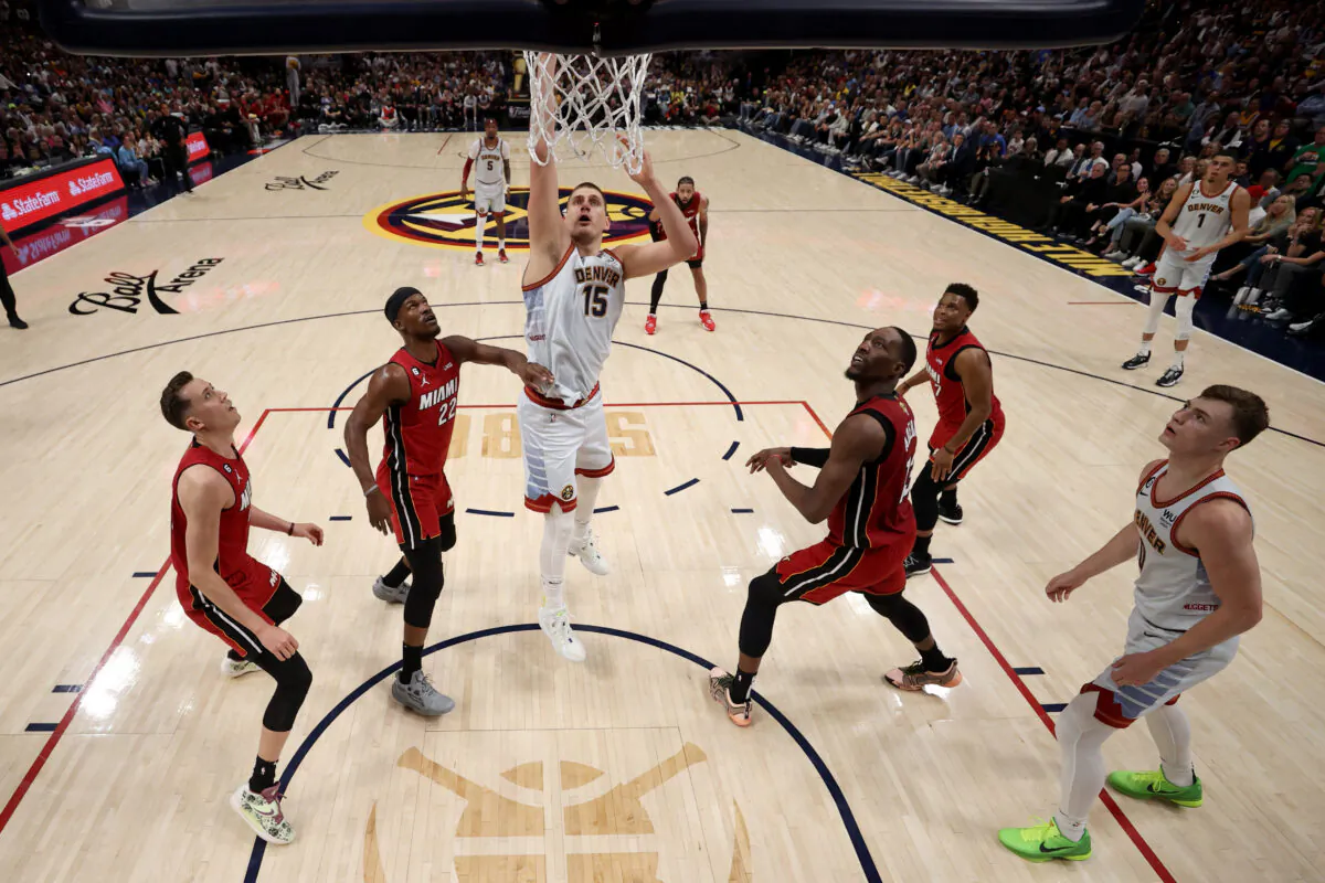 Nikola Jokic (15) of the Denver Nuggets drives to the basket during the second quarter against the Miami Heat in Game Five of the 2023 NBA Finals at Ball Arena in Denver on June 12, 2023.  (Matthew Stockman/Getty Images)