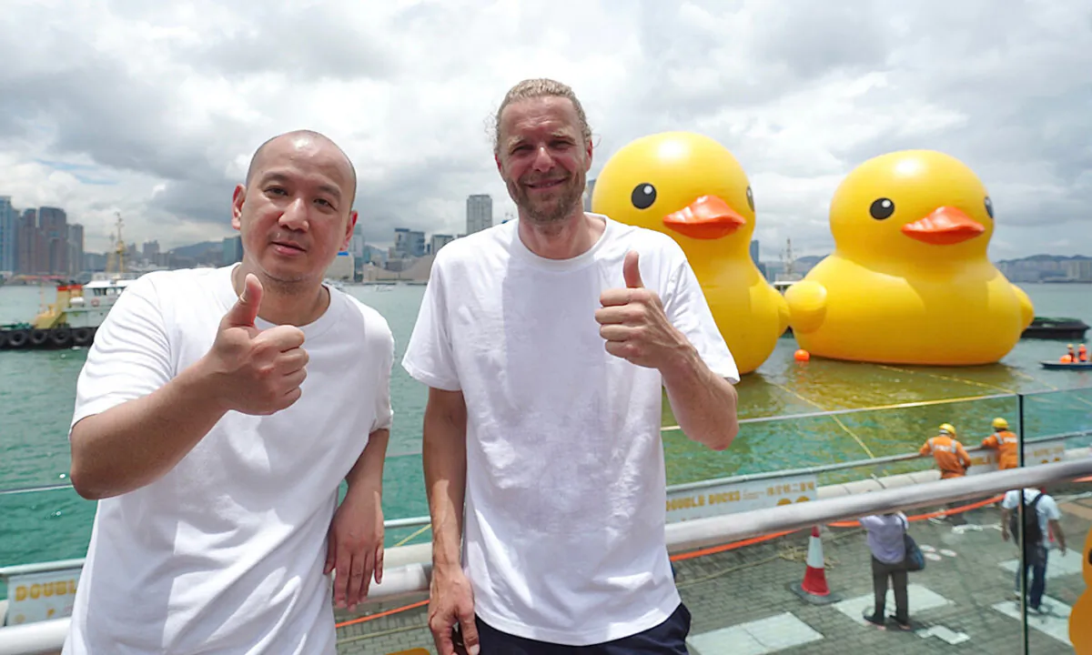 Dutch artist Florentijn Hofman, creator of the Yellow Duck (R), and SK Lam, founder, organizer and curator of AllRightsReserved (L), unveil the event. (Benson Lau/The Epoch Times)