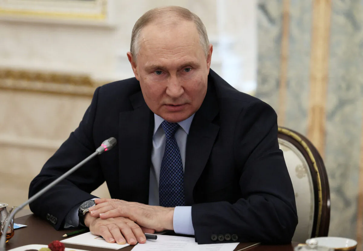Russian President Vladimir Putin attends a meeting with war correspondents at the Kremlin in Moscow on June 13, 2023. (Sputnik/Gavriil Grigorov/Kremlin via Reuters)