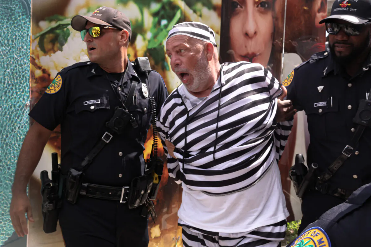 Dominic Santana is taken into custody outside of the Wilkie D. Ferguson Jr. federal courthouse following an incident that occurred when the motorcade carrying former President Donald Trump departed the courthouse on June 13, 2023 in Miami, Florida. (Scott Olson/Getty Images)