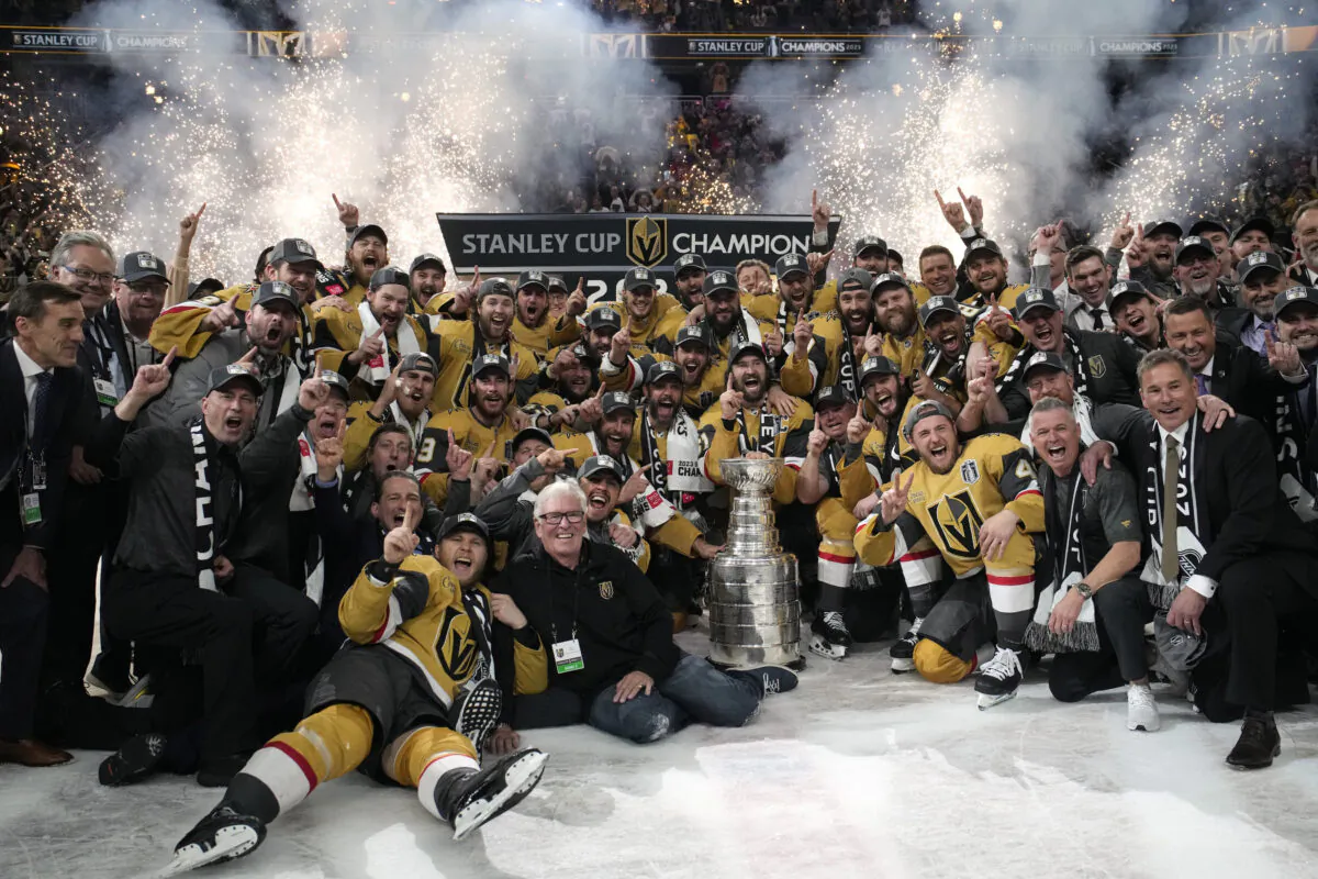 Members of the Vegas Golden Knights pose with the Stanley Cup after the Knights defeated the Florida Panthers in Game 5 of the NHL hockey Stanley Cup Finals in Las Vegas on June 13, 2023. (John Locher/AP Photo)