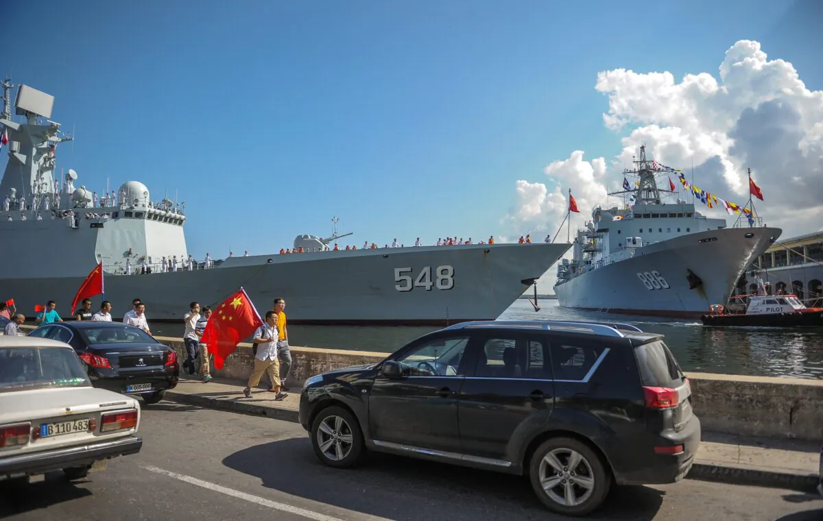 Chinese Navy ships Type 054A (NATO codenome: Jiankai II) and frigate 548 Yiyang (R) and replenishment ship 886 Qiandaohu enter the port of Havana on Nov. 10, 2015. (Yamil Lage/AFP via Getty Images)