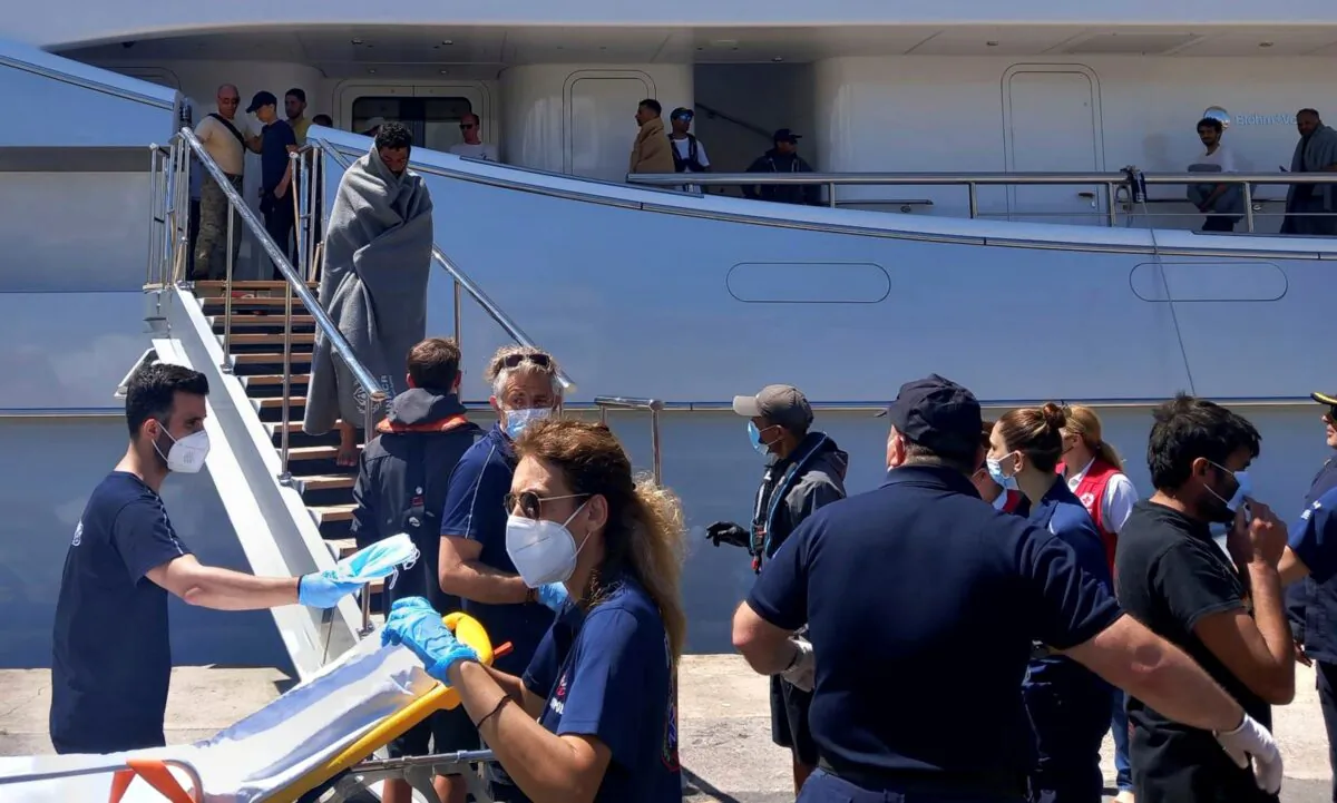 Survivors arrive by yacht after a rescue operation at the port in Kalamata town, about 240 kilometers (150miles) southwest of Athens, Greece, on June 14, 2023. (www.argolikeseidhseis.gr via AP)