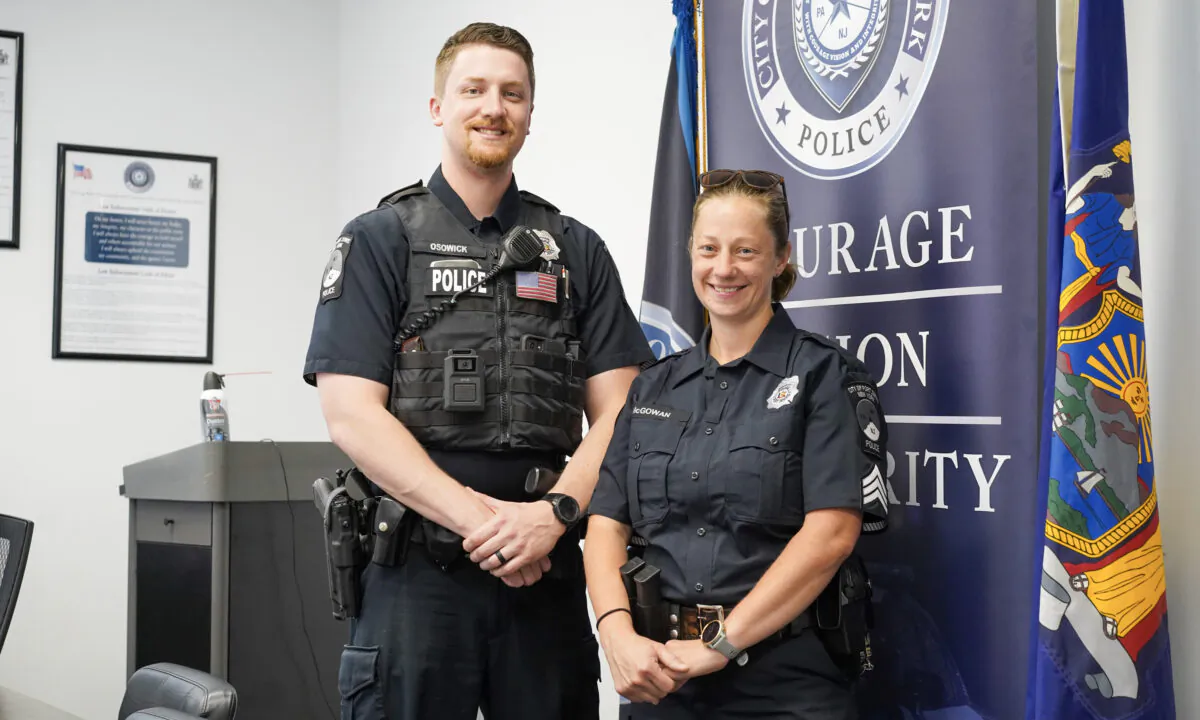 Police officer Nicholas Osowick and Sgt. Nicole McGowan at the Port Jervis Police Department in Port Jervis, N.Y., on June 8, 2023. (Cara Ding/The Epoch Times)