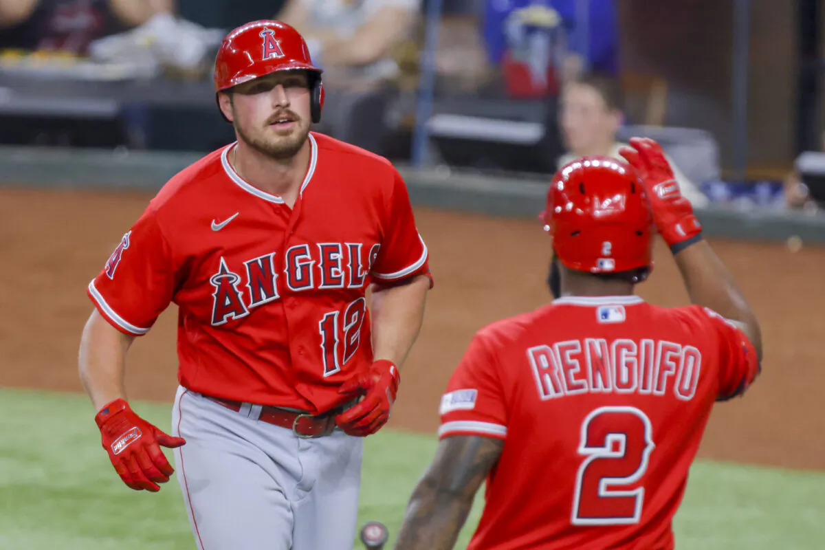 Los Angeles Angels' Hunter Renfroe (12) and Luis Rengifo (2) celebrate together after Renfroe hit a home run during the sixth inning of a baseball game against the Texas Rangers, in Arlington, Texas, on June 13, 2023. (Gareth Patterson/AP Photo)