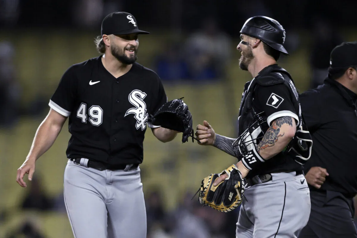 Chicago White Sox relief pitcher Kendall Graveman (L), celebrates with catcher Yasmani Grandal after the White Sox defeated the Los Angeles Dodgers in a baseball game in Los Angeles, on June 14, 2023. (Alex Gallardo/AP Photo)
