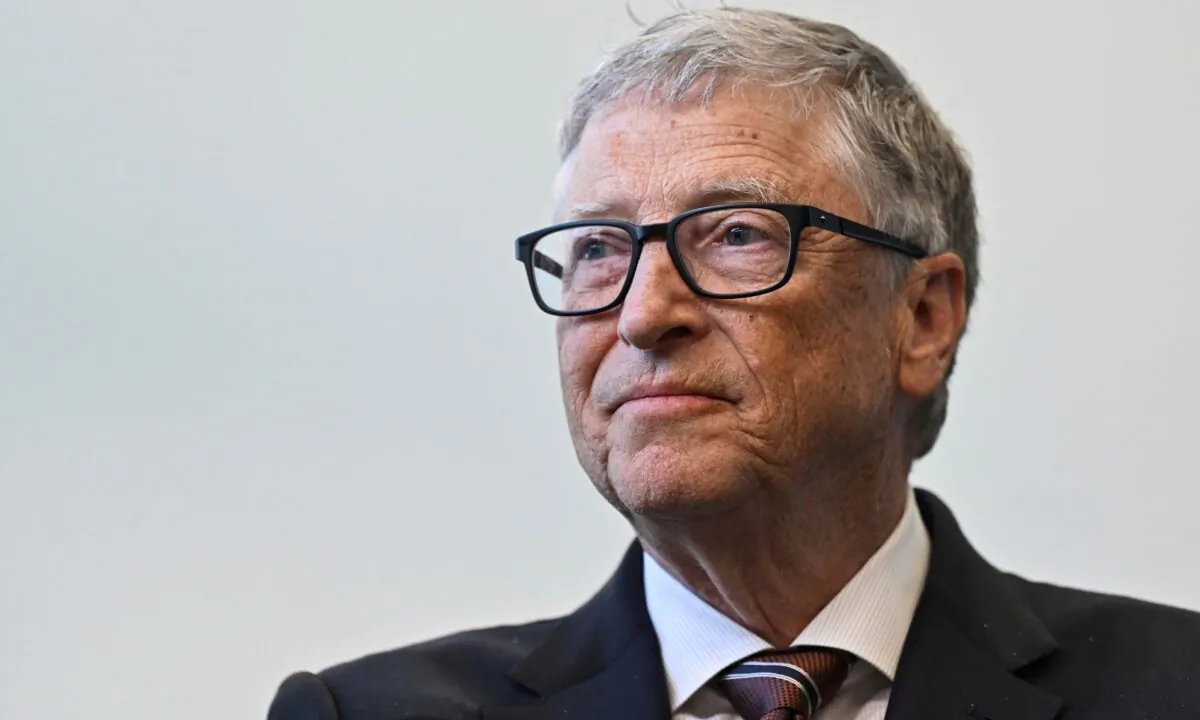 Bill Gates reacts during a visit with Britain's Prime Minister Rishi Sunak at the Imperial College University, in central London on Feb. 15, 2023. (Justin Tallis/Pool Photo via AP)