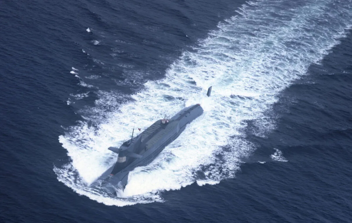 A nuclear-powered submarine of the People's Liberation Army Navy's North Sea Fleet prepares to dive into the sea on Oct. 29, 2013. (AFP/AFP via Getty Images)