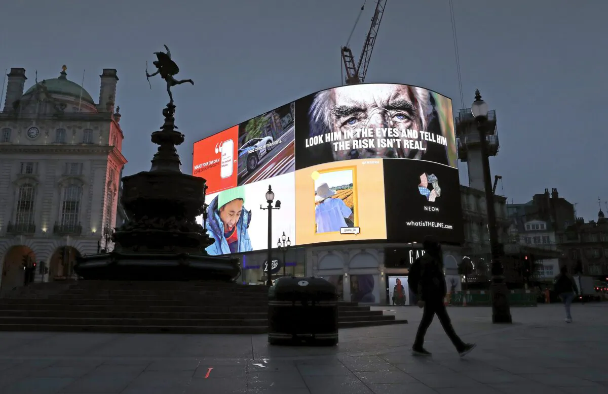 COVID-19 messaging is seen on the advertising hoarding at Piccadilly Circus during the UK's third national lockdown, in London, on Feb. 3, 2021. (Chris Jackson/Getty Images)