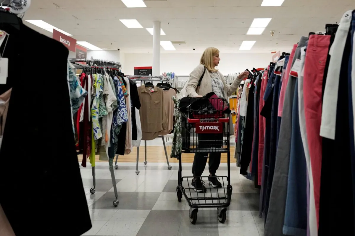 A customer checks prices of clothing at a retail store in Vernon Hills, Ill., on June 12, 2023. (Nam Y. Huh/AP Photo)
