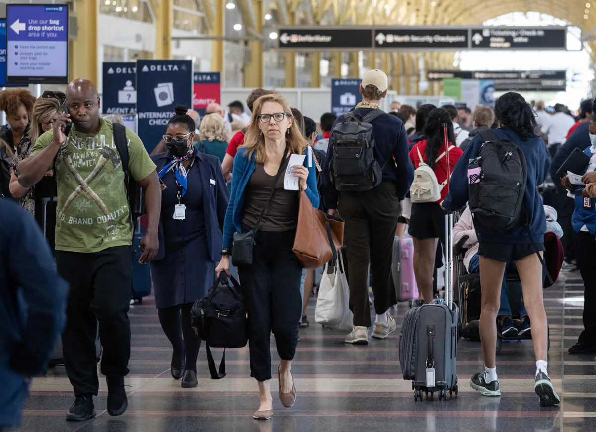 Passengers check in for their flights at the start of the Memorial Day weekend at Reagan National Airport in Arlington, Virginia on May 26, 2023. (Andrew Caballero-Reynolds/AFP via Getty Images/TNS)