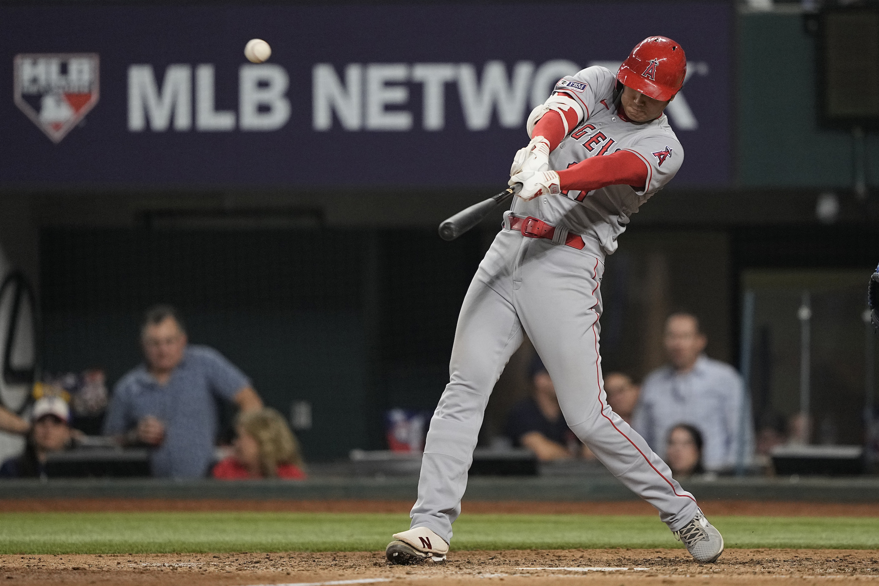 Gio Urshela of the Los Angeles Angels is tended to by a trainer after  News Photo - Getty Images