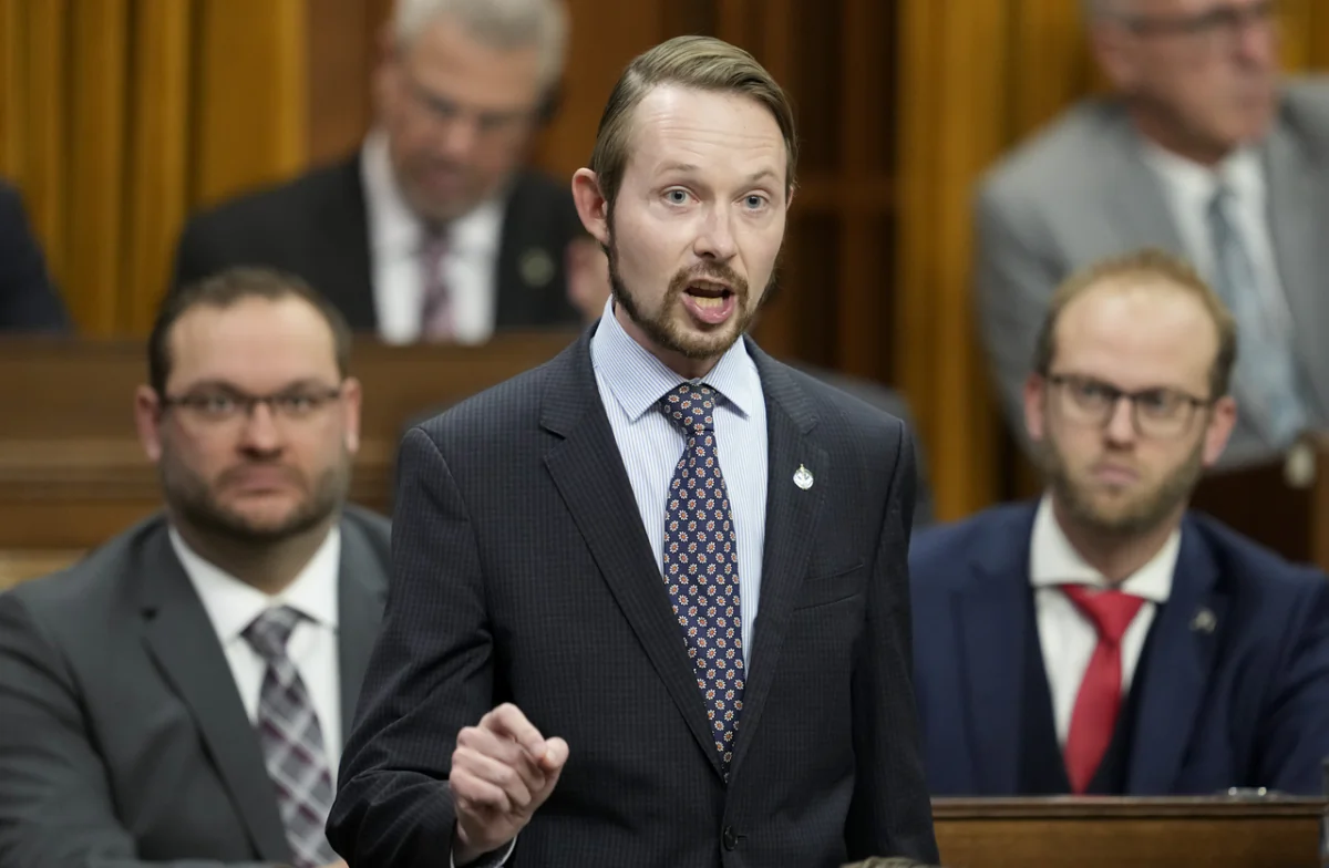 Conservative MP Michael Cooper rises during Question Period in Ottawa on Nov. 22, 2022. (Adrian Wyld/The Canadian Press)