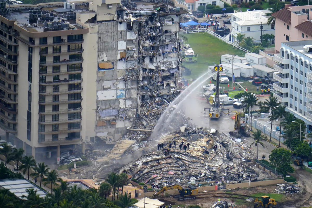 Rescue personnel work at the remains of the Champlain Towers South condo building in Surfside, Fla., on June 25, 2021. (Gerald Herbert/AP Photo) 