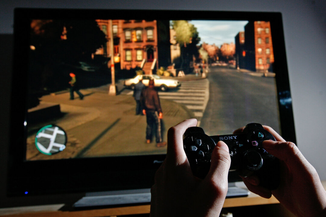 A man plays Grand Theft Auto IV on the game's day of release in London on April 29, 2008. (Cate Gillon/Getty Images)