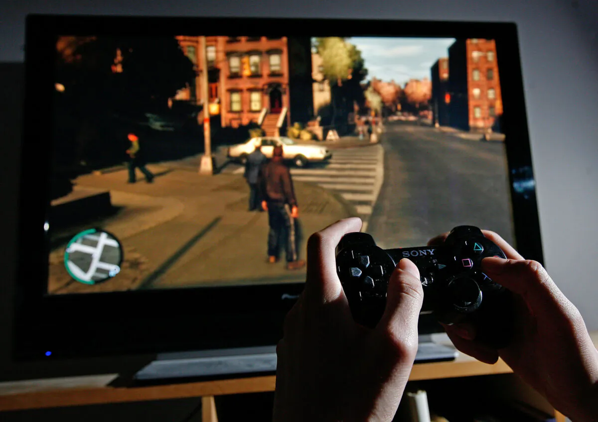 A man plays Grand Theft Auto IV on the game's day of release in London on April 29, 2008. (Cate Gillon/Getty Images)