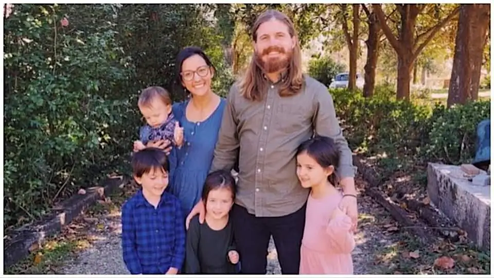 Ross McKnight (right), owner of Backwater Foie Gras farm in Louisiana, stands with his wife and four children. (Courtesy of Backwater Foie Gras)