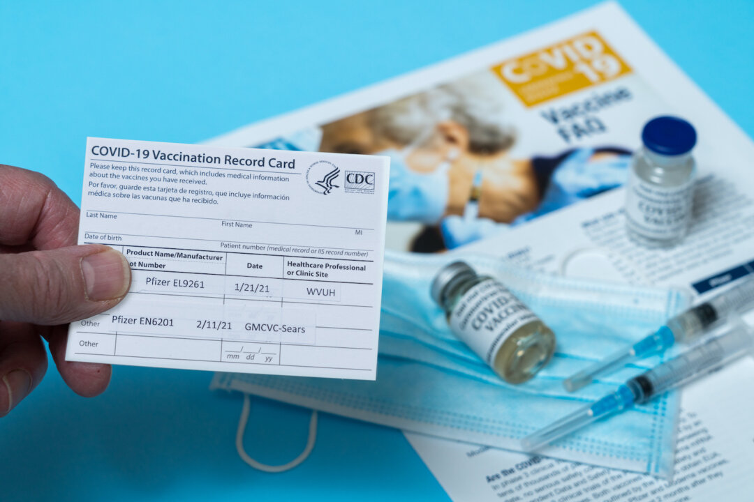 Morgantown, WV - 22 February 2021: Covid-19 vaccination record card showing first and second doses of Pfizer vaccine in West Virginia (Steve Heap/Shutterstock)