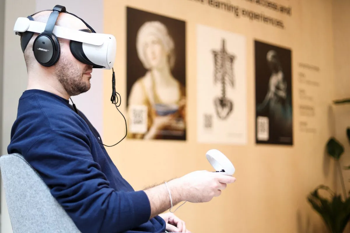 A Meta worker uses a Meta Quest VR headset at the Meta showroom in Brussels, Belgium, on Dec. 07, 2022. (Kenzo Tribouillard/AFP via Getty Images)