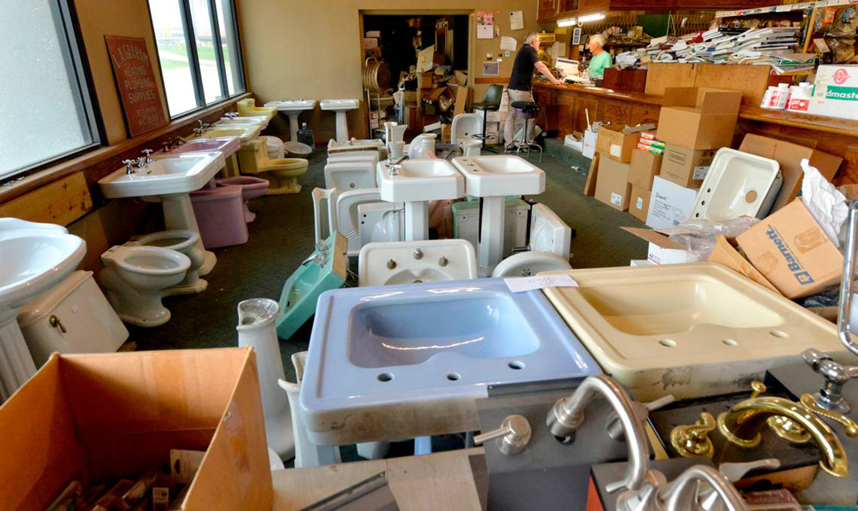 Bill Graham's showroom floor is a sea of dozens of white and pastel-colored sinks and toilet bowls