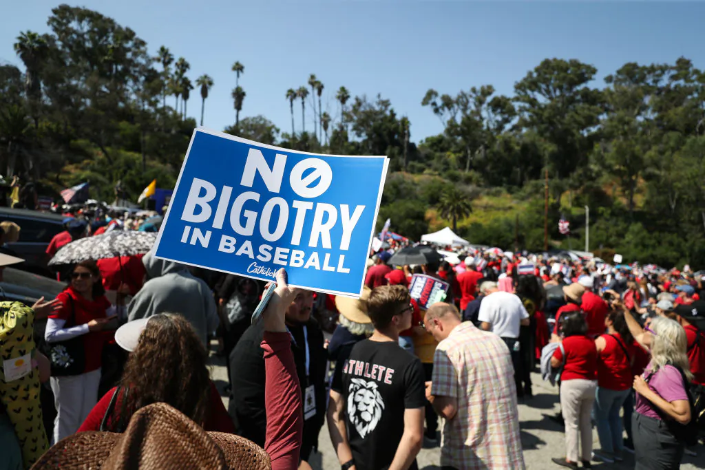 Protesters hold signs at a Catholics for Catholics event in response to the Dodgers' Pride Night event including the Sisters of Perpetual Indulgence, before the game between the Los Angeles Dodgers and the San Francisco Giants at Dodger Stadium in Los Angeles on June 16, 2023. (Meg Oliphant/Getty Images)