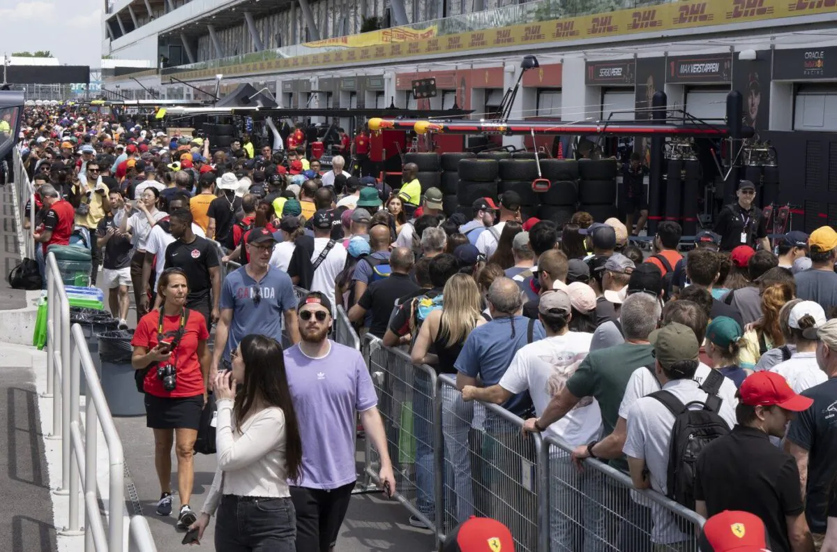 Race fans walk through pit lane during the open house at the Canadian Grand Prix June 15, 2023, in Montreal. (The Canadian Press/Ryan Remiorz)