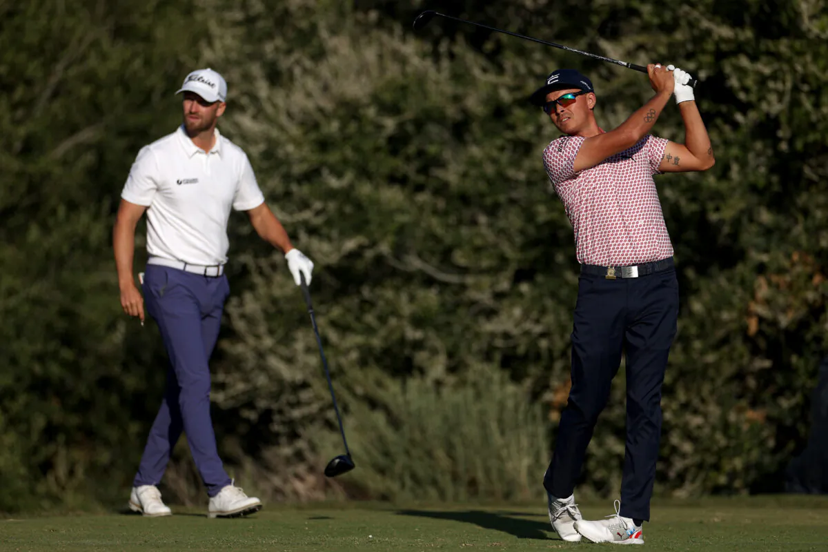 Wyndham Clark of the United States watches as Rickie Fowler of the United States plays his shot on the 12th tee during the third round of the 123rd U.S. Open Championship at The Los Angeles Country Club in Los Angeles on June 17, 2023. (Harry How/Getty Images)