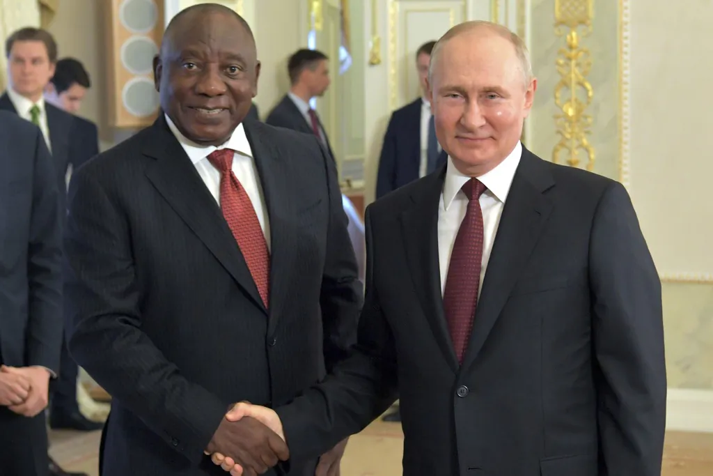 Russian President Vladimir Putin and South African President Cyril Ramaphosa (L) pose for a photo during a meeting in St. Petersburg, Russia, on June 17, 2023. (Evgeny Biyatov/Photo host Agency RIA Novosti via AP)