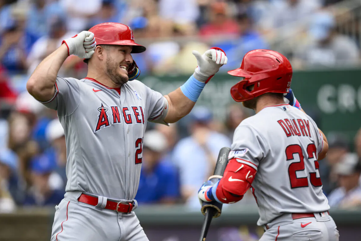 Los Angeles Angels' Mike Trout, left, celebrates his home run against the Kansas City Royals with teammate Brandon Drury (23) during the fifth inning of a baseball game in Kansas City on June, 18, 2023. (Reed Hoffmann/AP Photo)