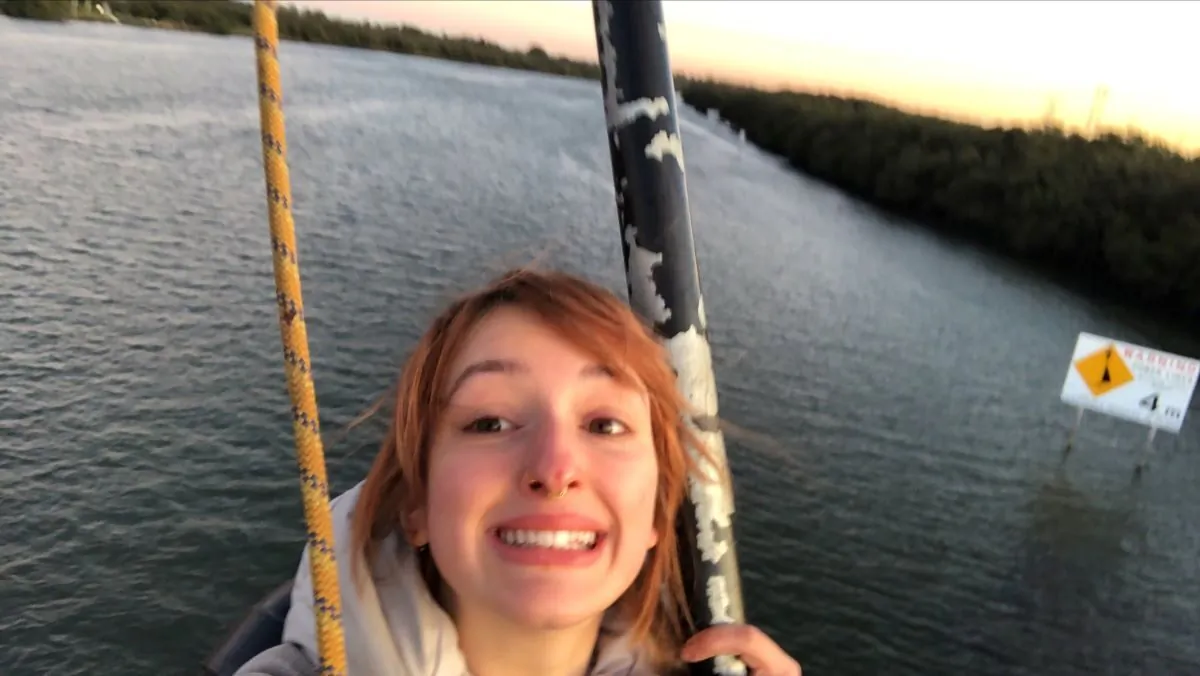 A supplied image of a protestor atop the Kooragang Rail Bridge in Newcastle, Monday, June 19, 2023. A protestor scaled the Kooragang Rail Bridge at the Newcastle port to block shipments of coal. (AAP Image/Supplied by Blockade Australia)