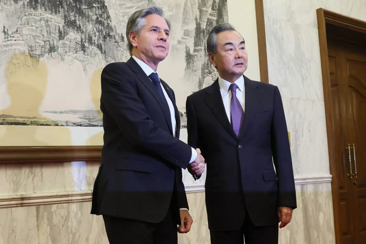 U.S. Secretary of State Antony Blinken (left) shakes hands with China's Director of the Office of the Central Foreign Affairs Commission Wang Yi at the Diaoyutai State Guesthouse in Beijing, China, on June 19, 2023. (LEAH MILLIS/POOL/AFP via Getty Images)