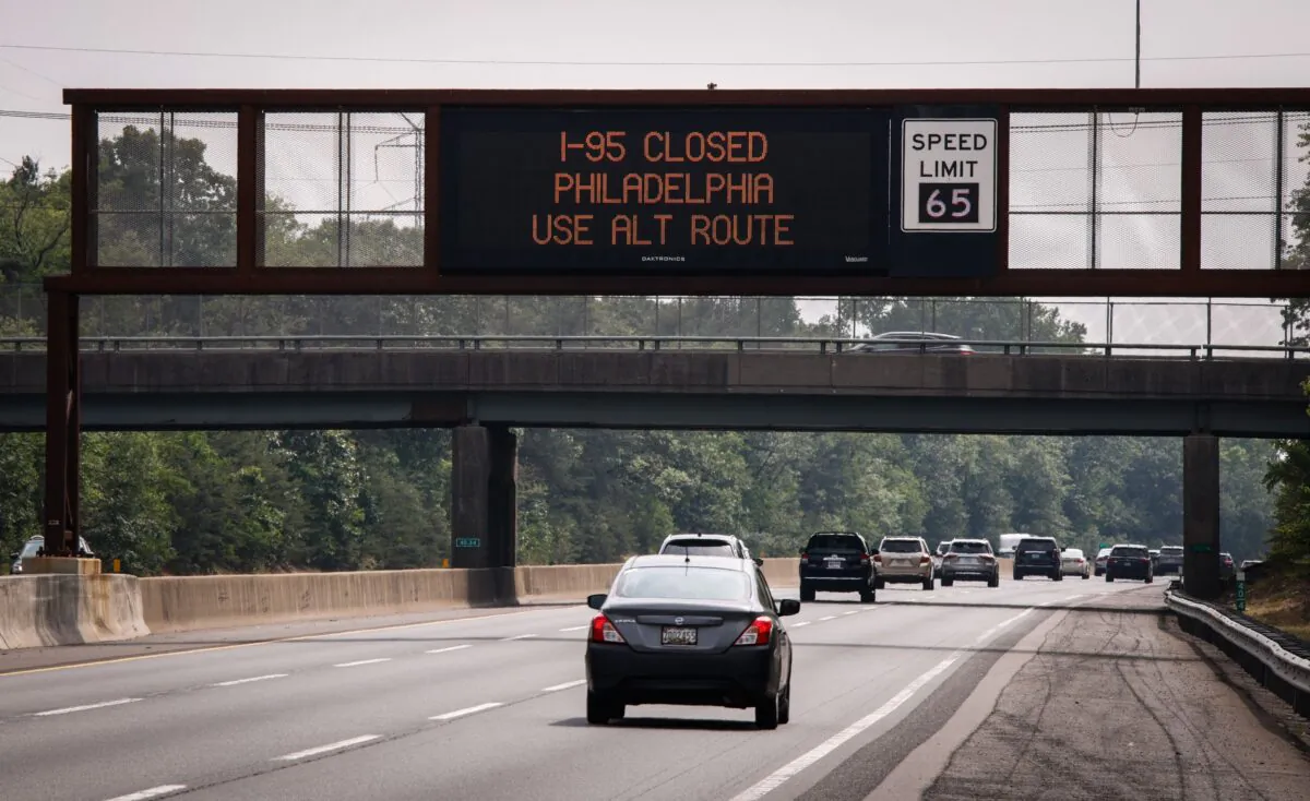 A warning sign is displayed due to a collapsed portion of Interstate 95, caused by a large vehicle fire in Philadelphia, Pa., on the route in Lawrence Township, New Jersey, on June 11, 2023. (Kena Betancur/AFP via Getty Images)