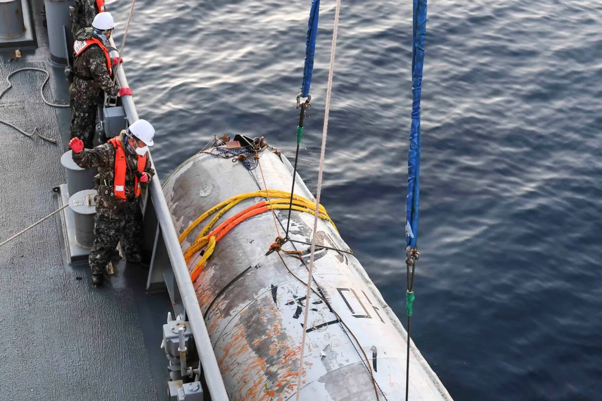 A part of what is believed to be a space launch vehicle that North Korea said crashed into the sea off the west coast of the divided peninsula, and which the South Korean military had salvaged, at an unidentified location in South Korea, on June 15, 2023. (The Defense Ministry/Handout via Reuters)