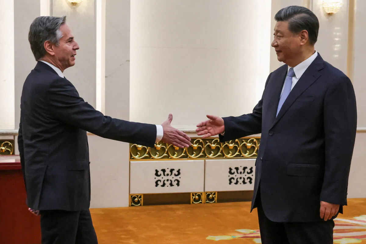 U.S. Secretary of State Antony Blinken (L) shakes hands with China's leader Xi Jinping in the Great Hall of the People in Beijing on June 19, 2023. (Leah Millis/POOL/AFP via Getty Images)