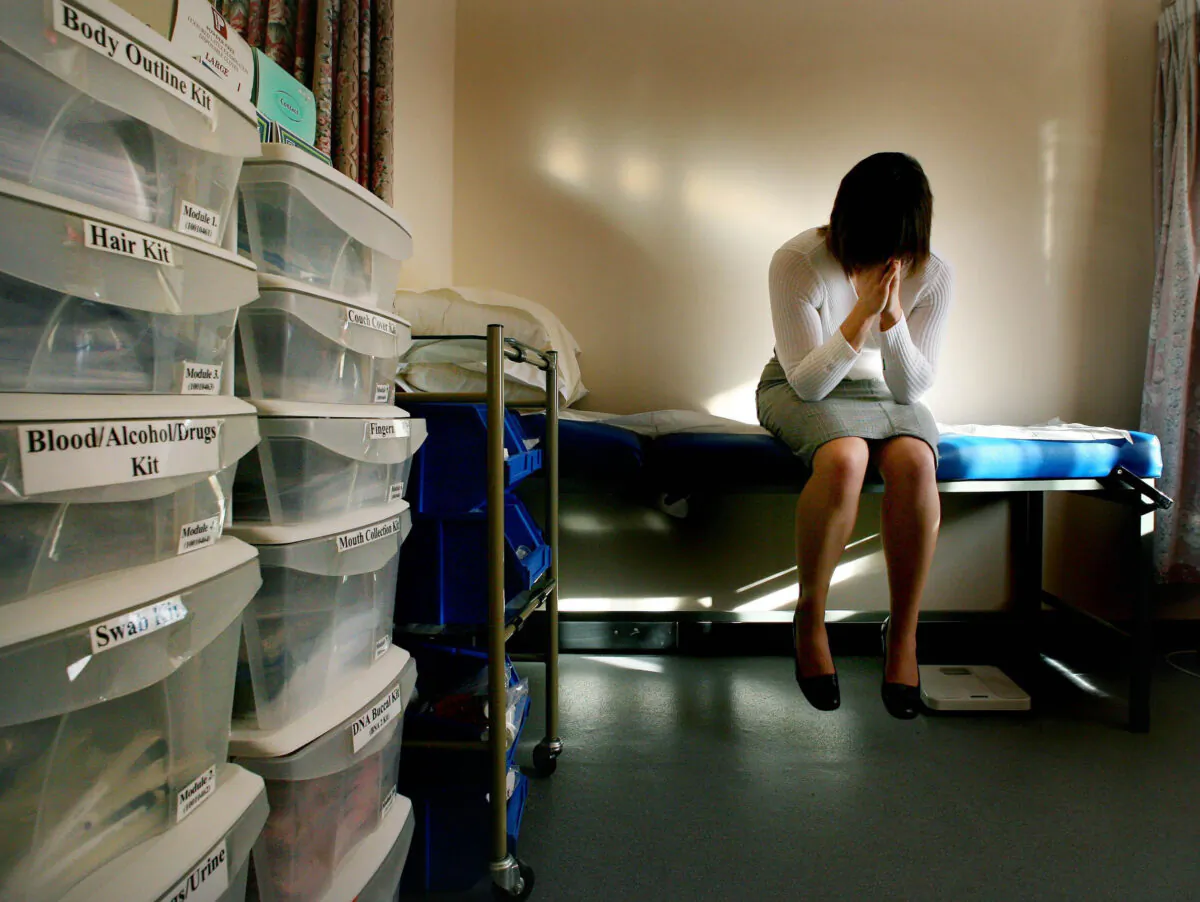 A model poses as a complainant waiting to seen by a doctor at a specialist rape clinic in Kent, England on Jan. 31, 2007. (Gareth Fuller/PA)