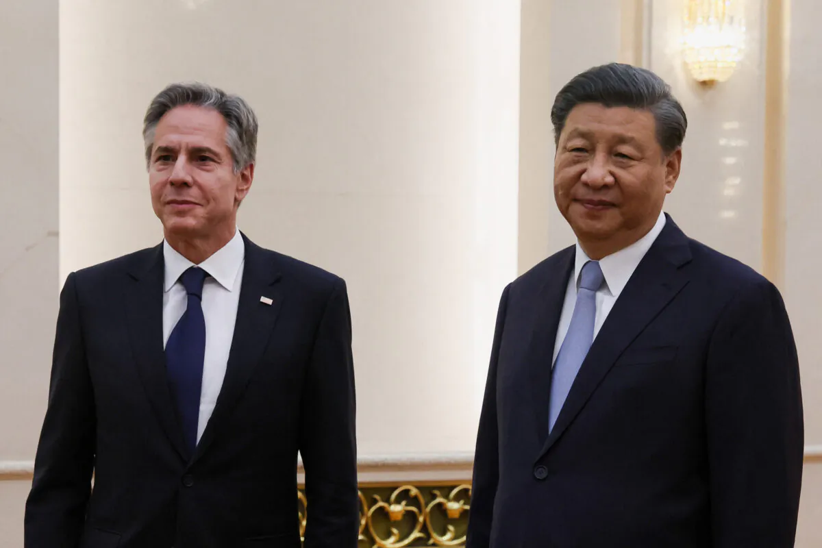 Chinese leader Xi Jinping (R) receives U.S. Secretary of State Antony Blinken prior to their meeting at the Great Hall of the People in Beijing on June 19, 2023. (Leah Millis/AFP via Getty Images)