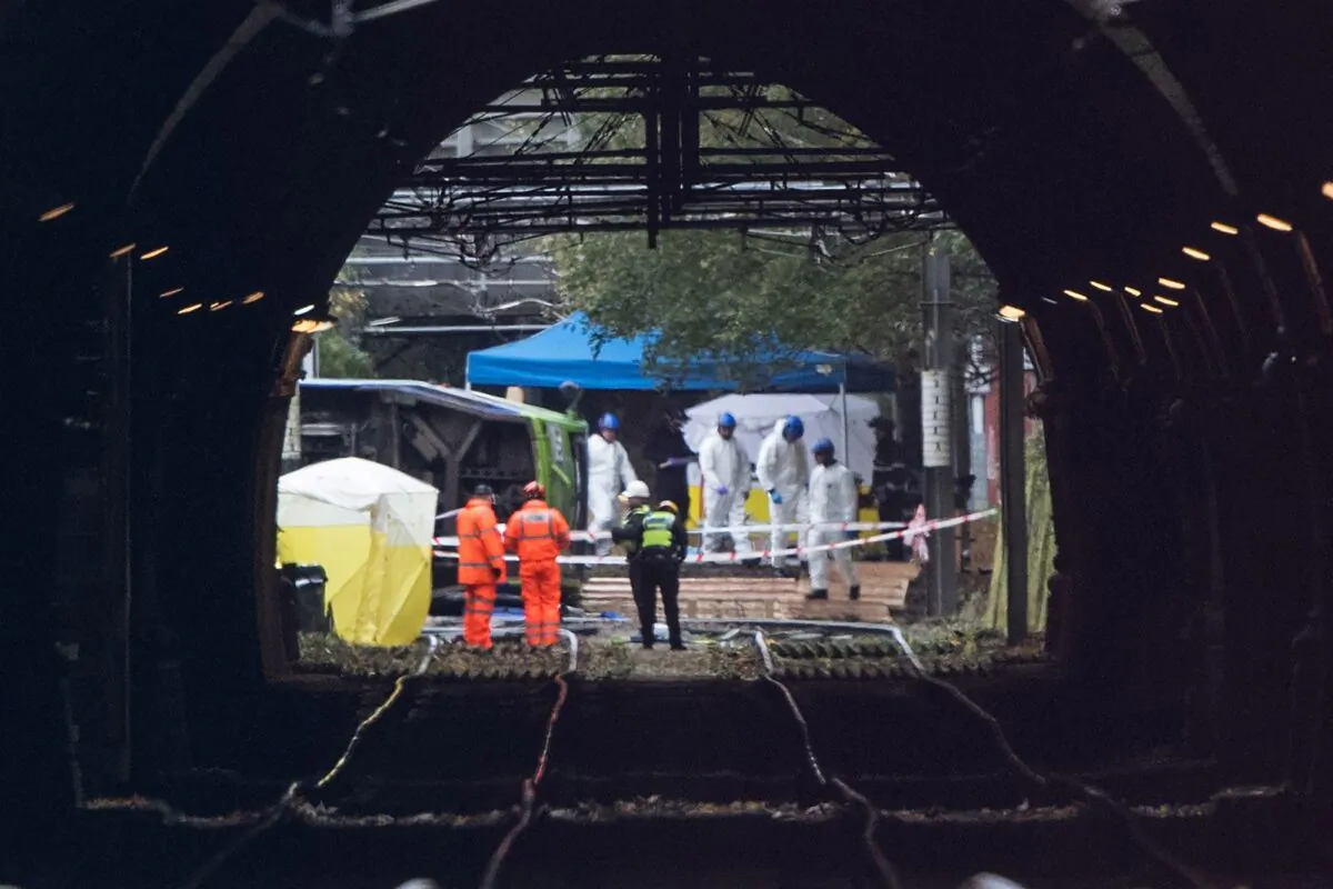 Crime officers working at the scene of a tram crash which killed six people in Croydon, England, on Nov. 10, 2016. (Getty Images)