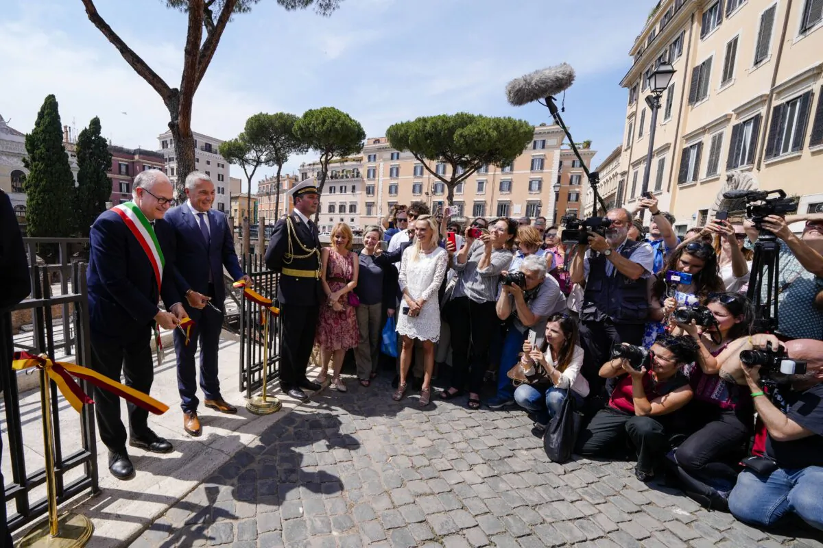 Rome's Mayor Roberto Gualtieri (L) and Bulgari CEO Jean-Christophe Babin cut the ribbon to inaugurate the walkways and nighttime illumination of the so called "Sacred Area" where four temples, dating back as far as the 3rd century B.C., stand smack in the middle of one of modern Rome's busiest crossroads on June 19, 2023. (Domenico Stinellis/AP Photo)