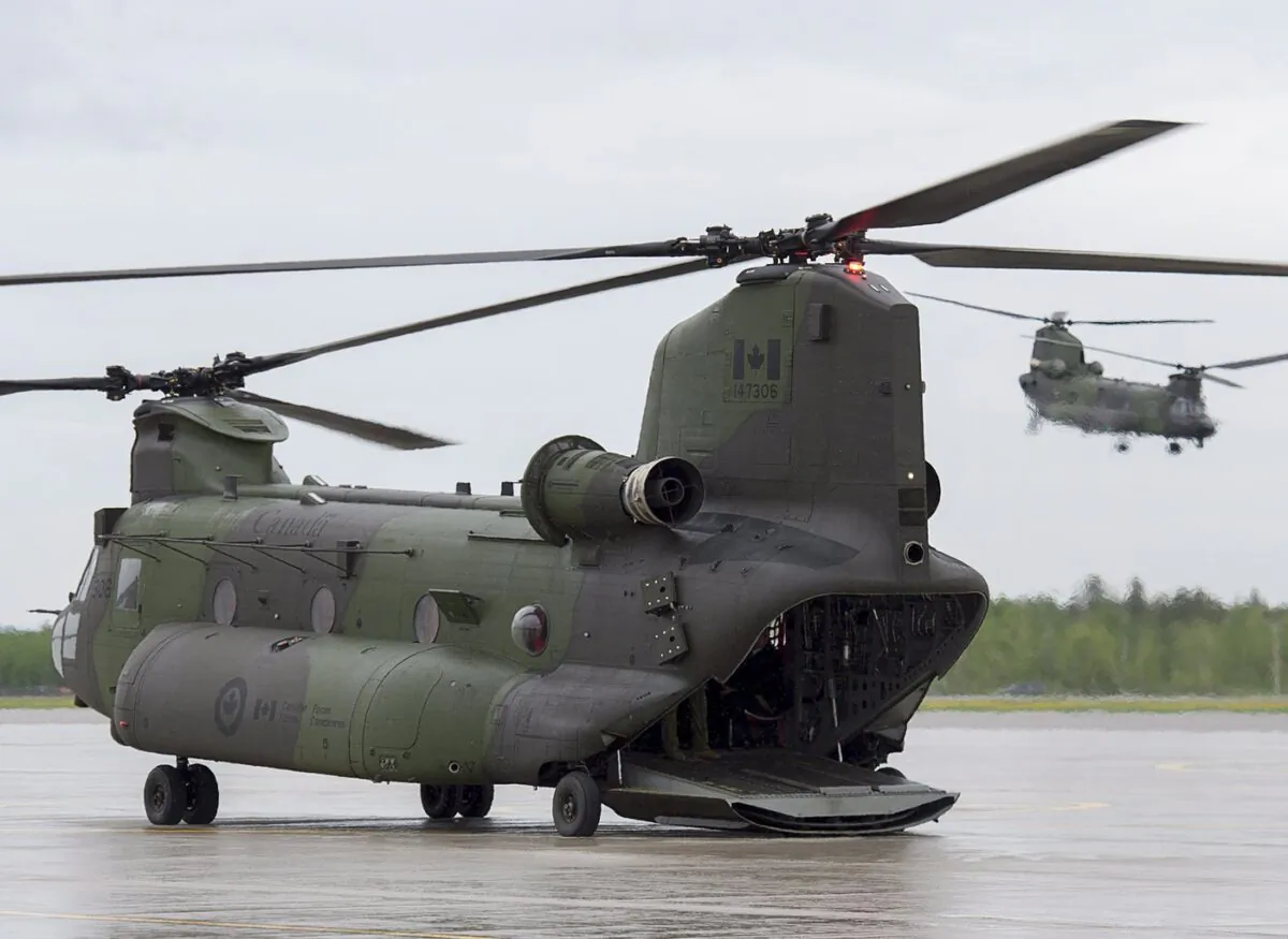 Two RCAF CH-147F Chinook, multi-mission, medium to heavy-lift helicopters are seen at CFB Bagotville in Bagotville, Que. on June 7, 2018. (The Canadian Press/Andrew Vaughan)