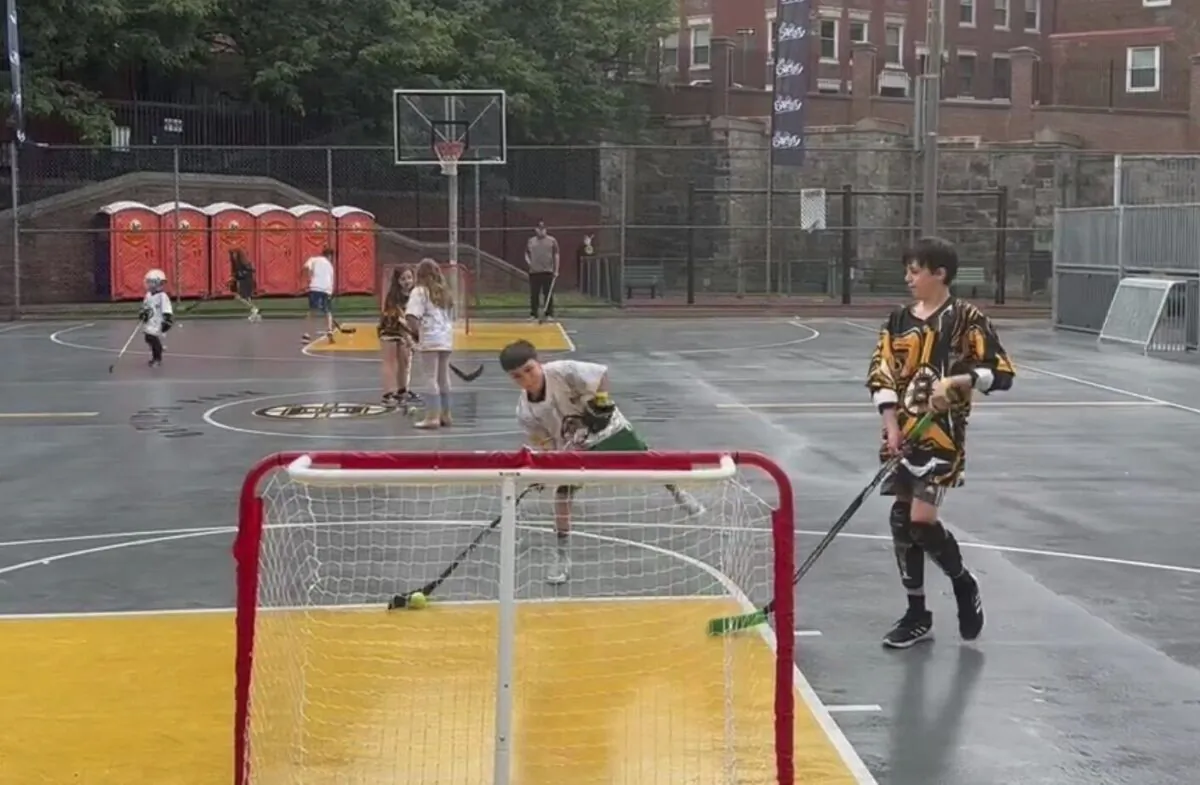 Kids play ball hockey at an NHL Street event—launching a street hockey program earlier this year aimed at getting more people interested in the sport, in Boston on June 17, 2023. (Jimmy Golen/AP Photo)