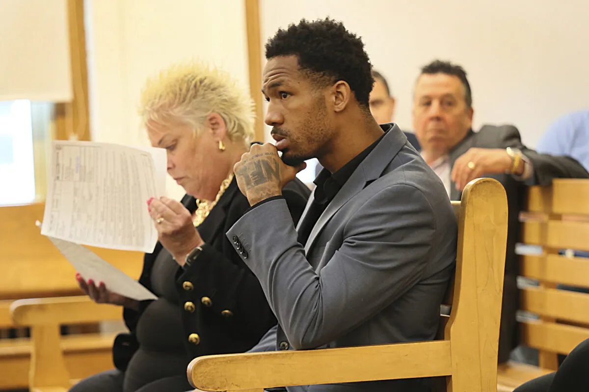 New England Patriots cornerback Jack Jones is seated at his arraignment on gun charges at East Boston Municipal Court in Boston on June 20, 2023. (Suzanne Kreiter/The Boston Globe via AP, Pool)