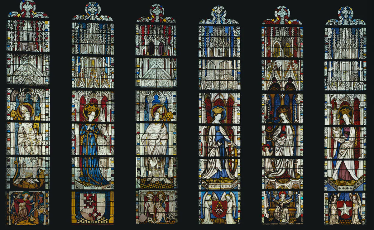 "The Virgin Mary and Five Standing Saints above Predella Panels," 1440–1446, by unknown  German artist.  Pot-metal glass, white glass, vitreous paint, silver stain;  each window 12 feet, 4 1/2 inches by 2 feet, 4 1/4 inches. The Cloisters Collection, Metropolitan Museum of Art, New York City. (Public Domain)