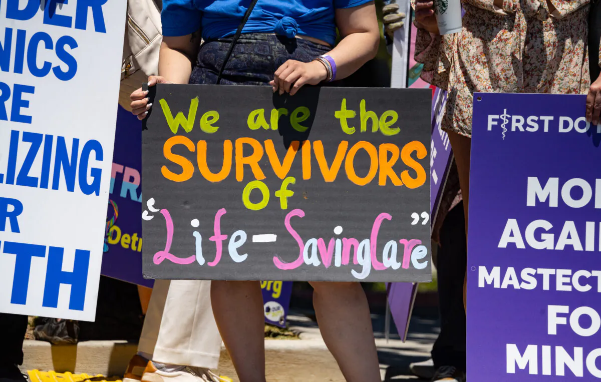 Detransitioners and their supporteres gather outside of the annual conference of the Pediatric Endocrine Society in San Diego, Calif., on May 6, 2023. (John Fredicks/The Epoch Times)