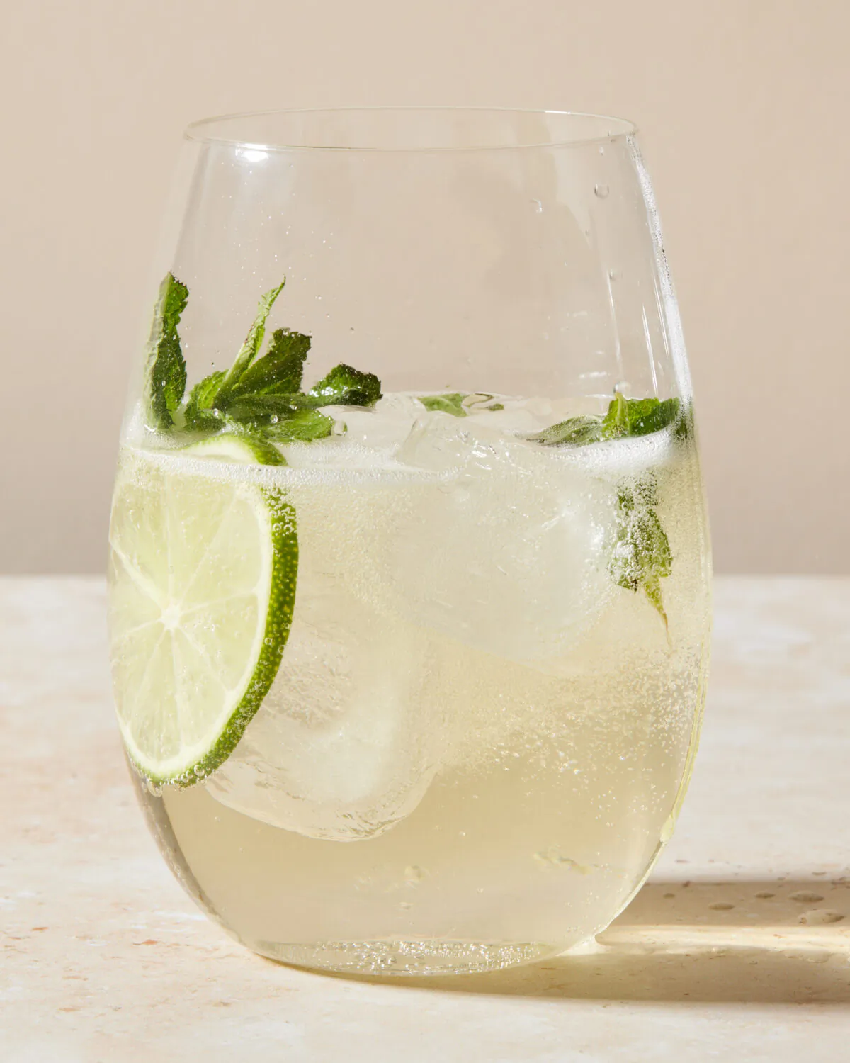 Enjoy a fresh and floral Italian cocktail featuring elderflower syrup, prosecco, and soda water.