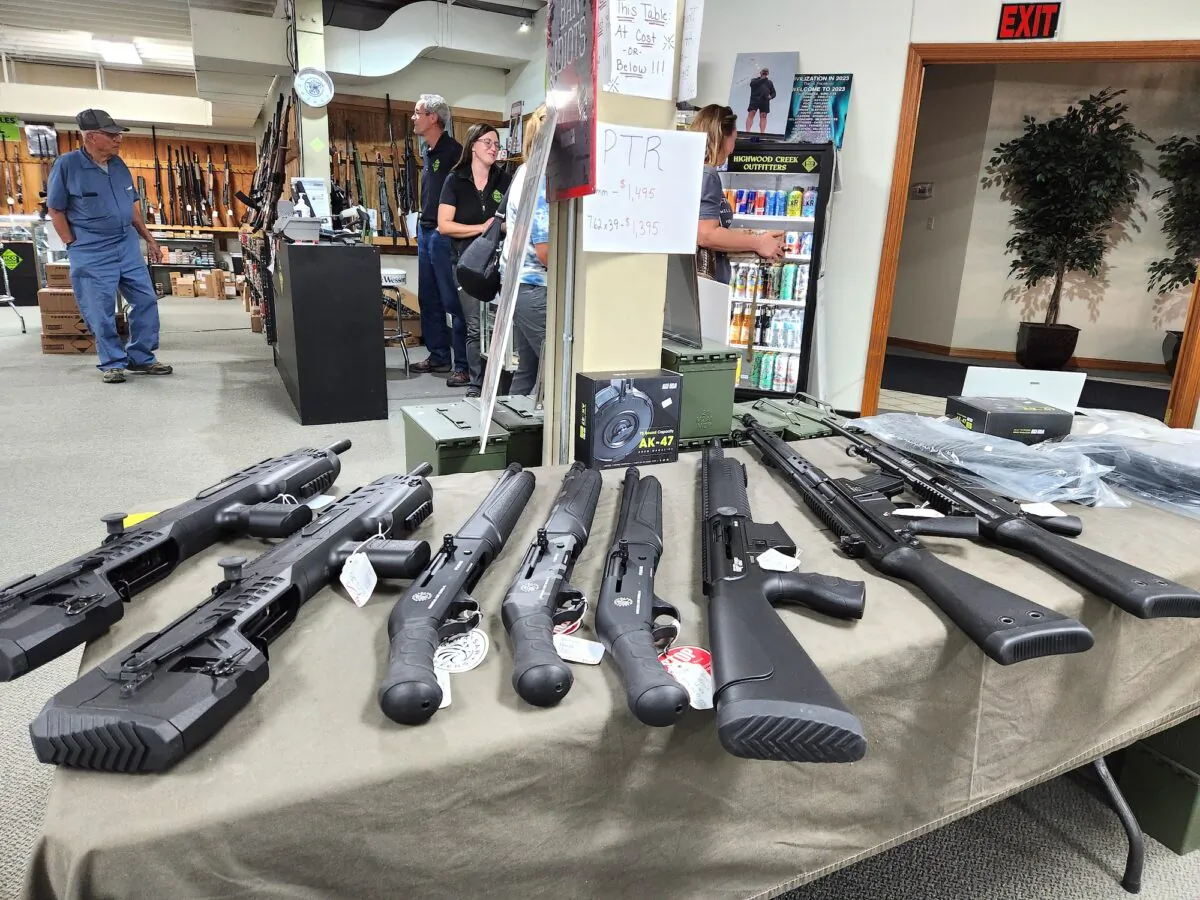 Various firearms are on display at Highwood Creek Outfitters in Grand Falls, Mont., on June 20, 2023. IRS Criminal Division agents raided the gun shop on June 14, seizing boxes filled with private gun owner information. (Allan Stein/The Epoch Times)
