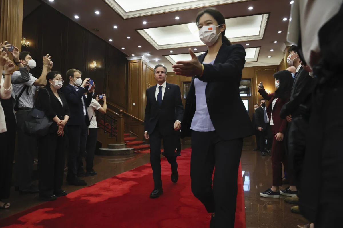 U.S. Secretary of State Antony Blinken (C) walks as he arrives to meet with China's top diplomat Wang Yi (not in photo) at the Diaoyutai State Guesthouse in Beijing on June 19, 2023. (Leah Millis/Pool Photo via AP)