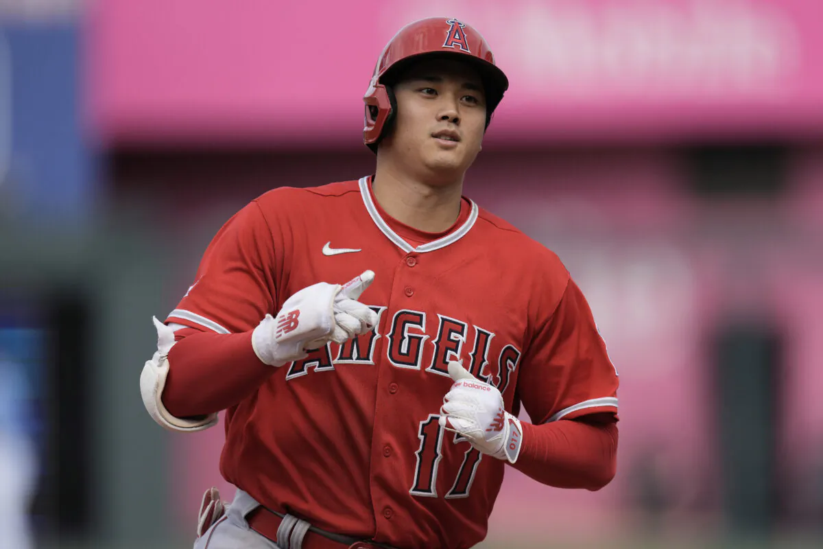 Los Angeles Angels' Shohei Ohtani, from Japan, celebrates as he runs the bases after hitting a solo home run during the seventh inning of a baseball game against the Kansas City Royals in Kansas City on June 17, 2023. (Charlie Riedel/AP Photo)